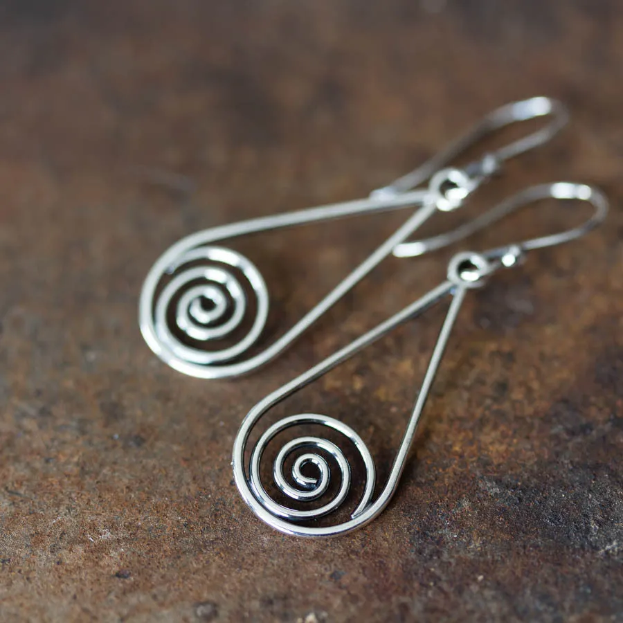 Long silver teardrop earrings with spirals inside