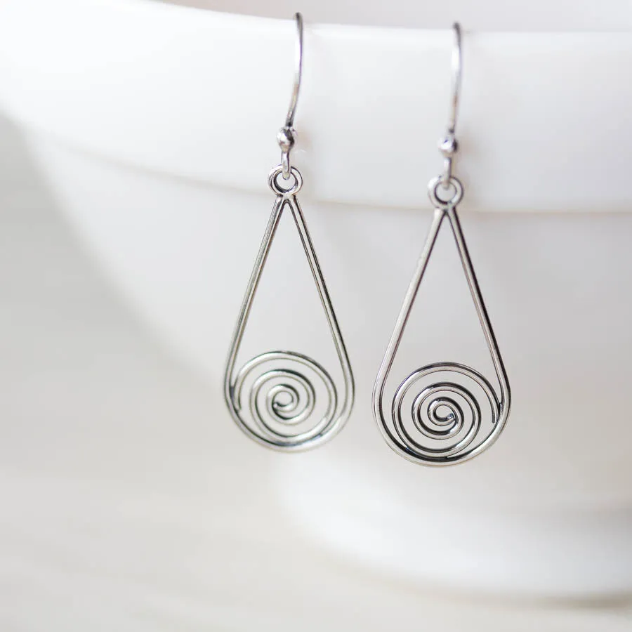 Long silver teardrop earrings with spirals inside