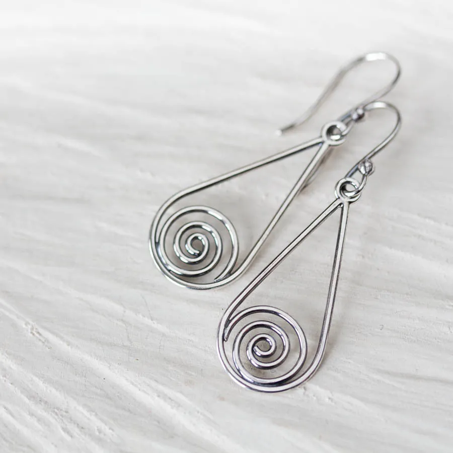 Long silver teardrop earrings with spirals inside