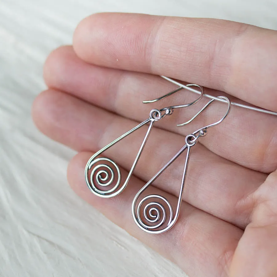 Long silver teardrop earrings with spirals inside